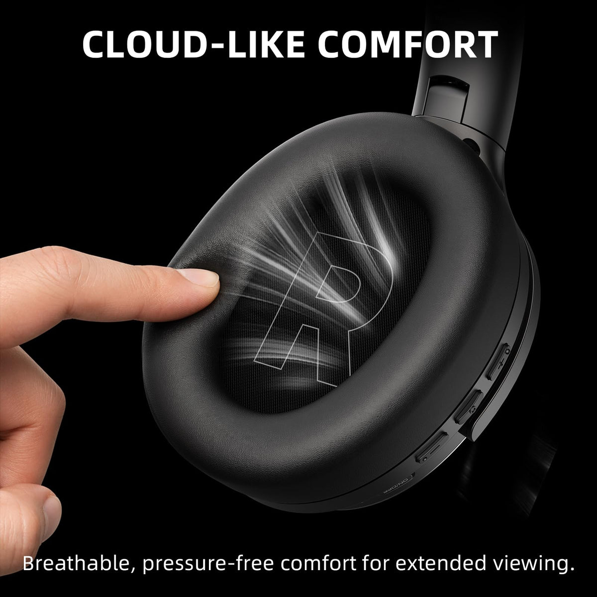 AOC headphones held next to hand for scale, shows compact portable size