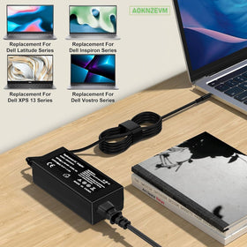 AOKNZEVM 65W Dell adapter in use with a Dell laptop, ready to charge.