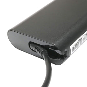 Close-up of the 7.4x5.0mm tip confirms Dell-compatible connector.