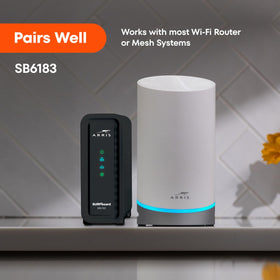 ARRIS SB6183 connected beside a router demonstrating stable wired network benefit