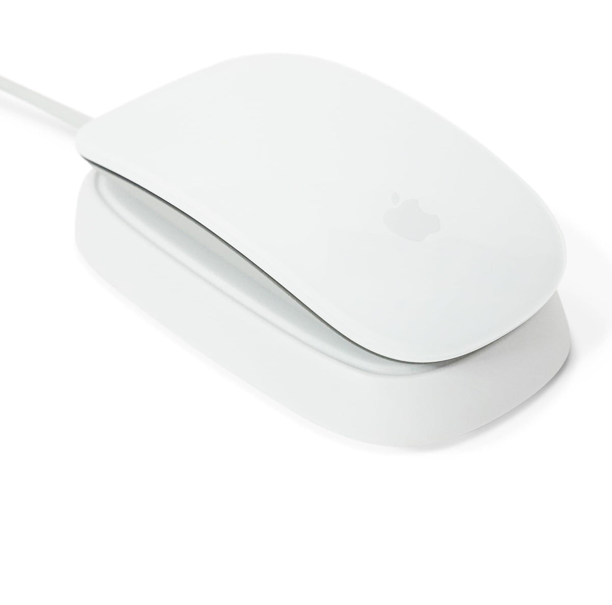 Ascrono charging station front view showing white dock and Magic Mouse, clean desk benefit