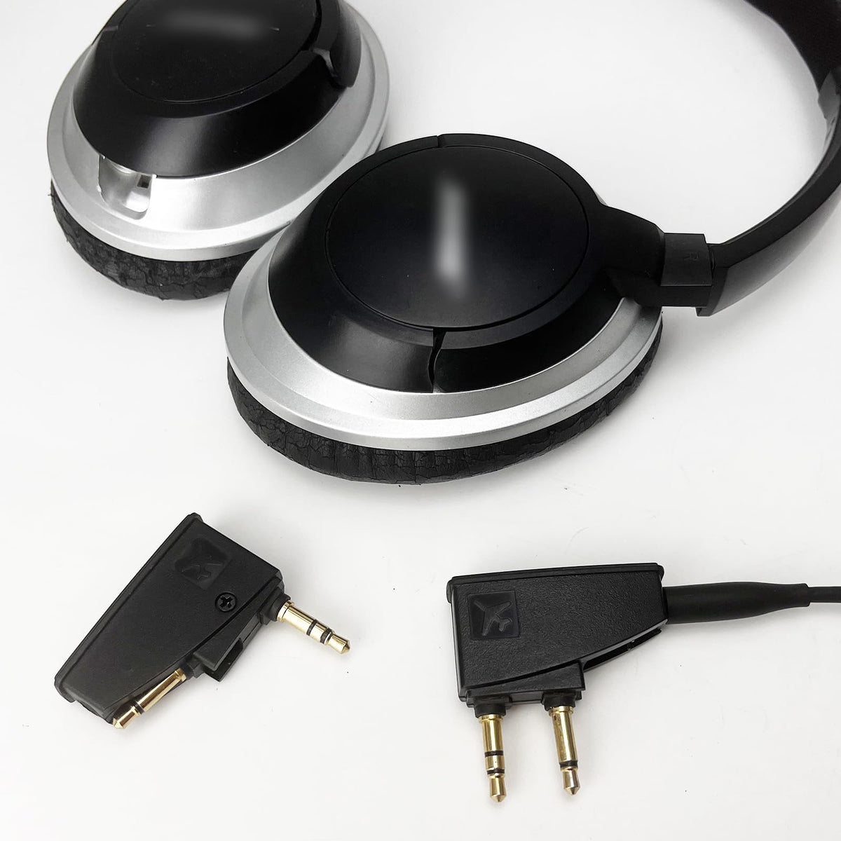 Asobilor packaging and contents with two adapters showing spare included convenience