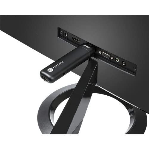 ASUS Chromebit CS10 on a desk turns a display into a computer-friendly workstation.