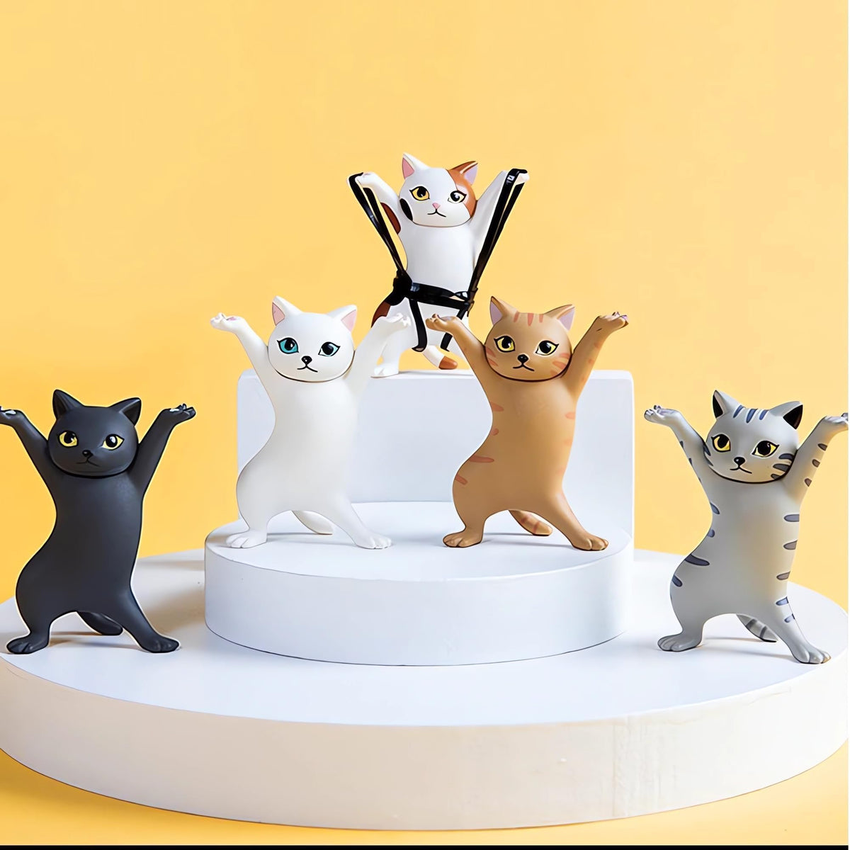 ATHAND anime raising hands cat model brings whimsy to home office decor.