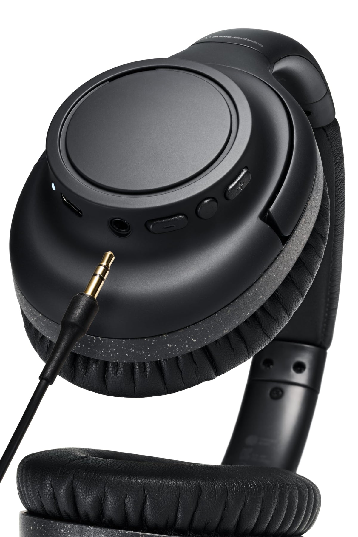 Audio-Technica ATH-S300BTBK wireless headphones shown in travel setup for on-the-go listening