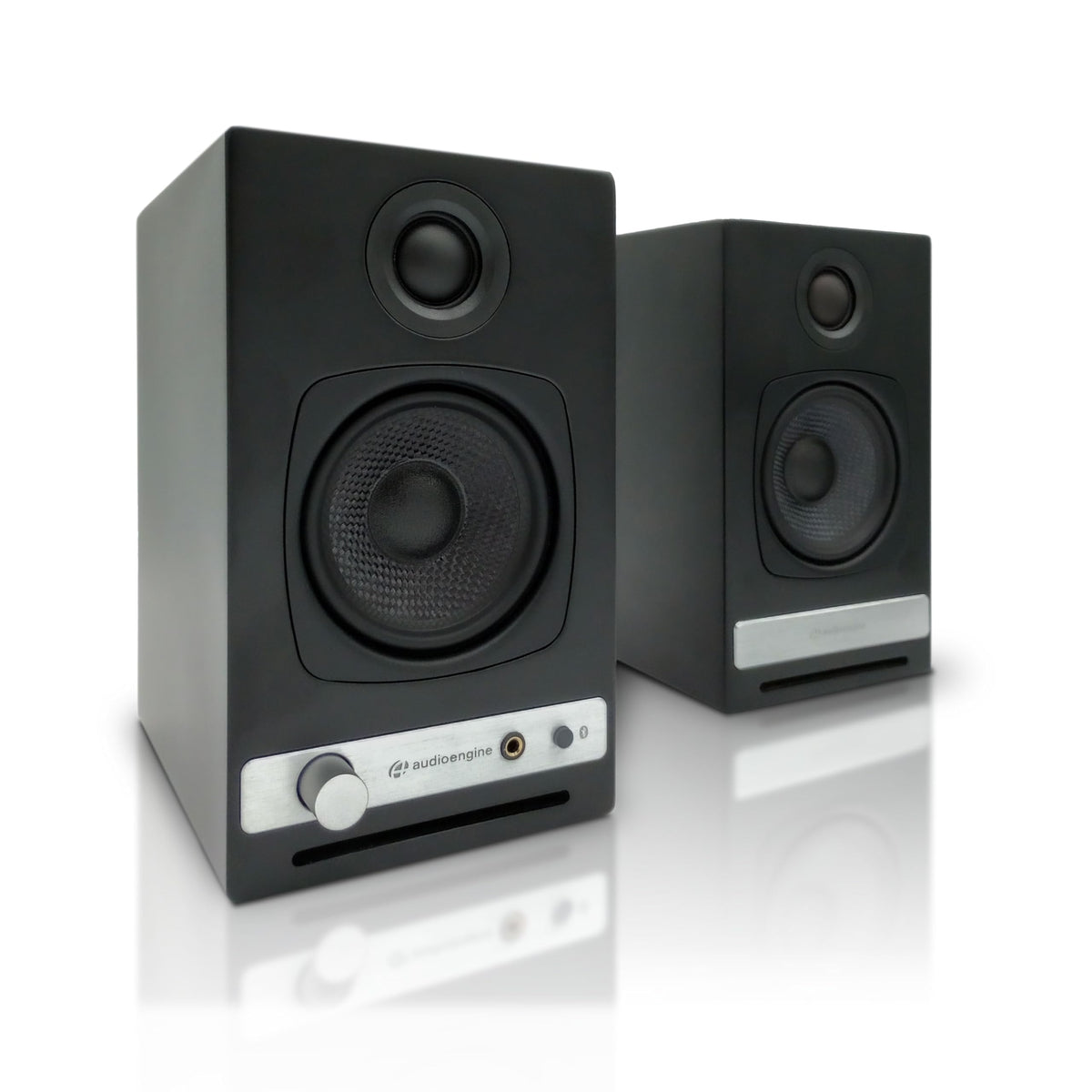 Audioengine A2-HD desk setup showing compact, room-filling desktop speakers.