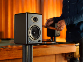 Audioengine A5+ cabinet detail in wood or bamboo finish.