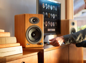 Audioengine A5+ gloss white finish adds modern room aesthetics