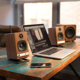 Audioengine HD4 desktop setup ready with elegant cabinet and punchy sound.