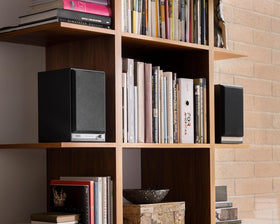 Audioengine HD5 real wood veneer cabinet in walnut finish adds warm aesthetics.