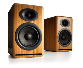 Audioengine P4 bamboo front-port design enhances bass control in compact spaces.