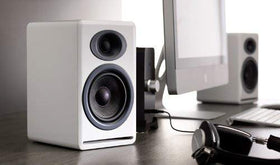 Audioengine P4 microfiber bags protect speakers during transport.