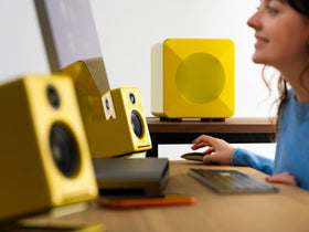 Audioengine S6 premium high-gloss yellow finish adds stylish vibe to living room