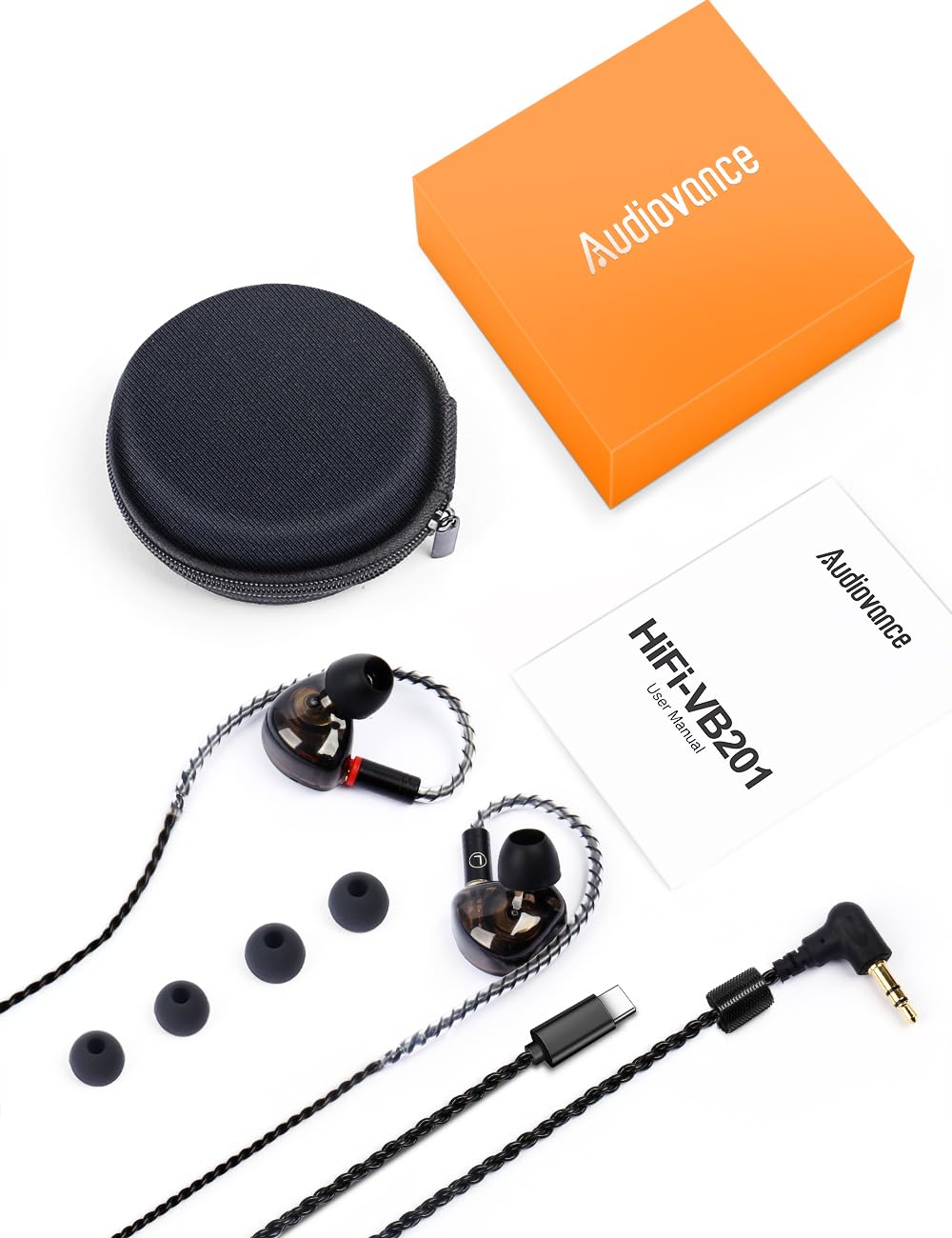 Audiovance accessories laid out including tips, adapter, and case for complete kit convenience