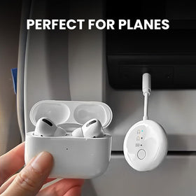 Avantree SoundJet R1 with included dual-prong adapter demonstrating airplane compatibility and easy fit
