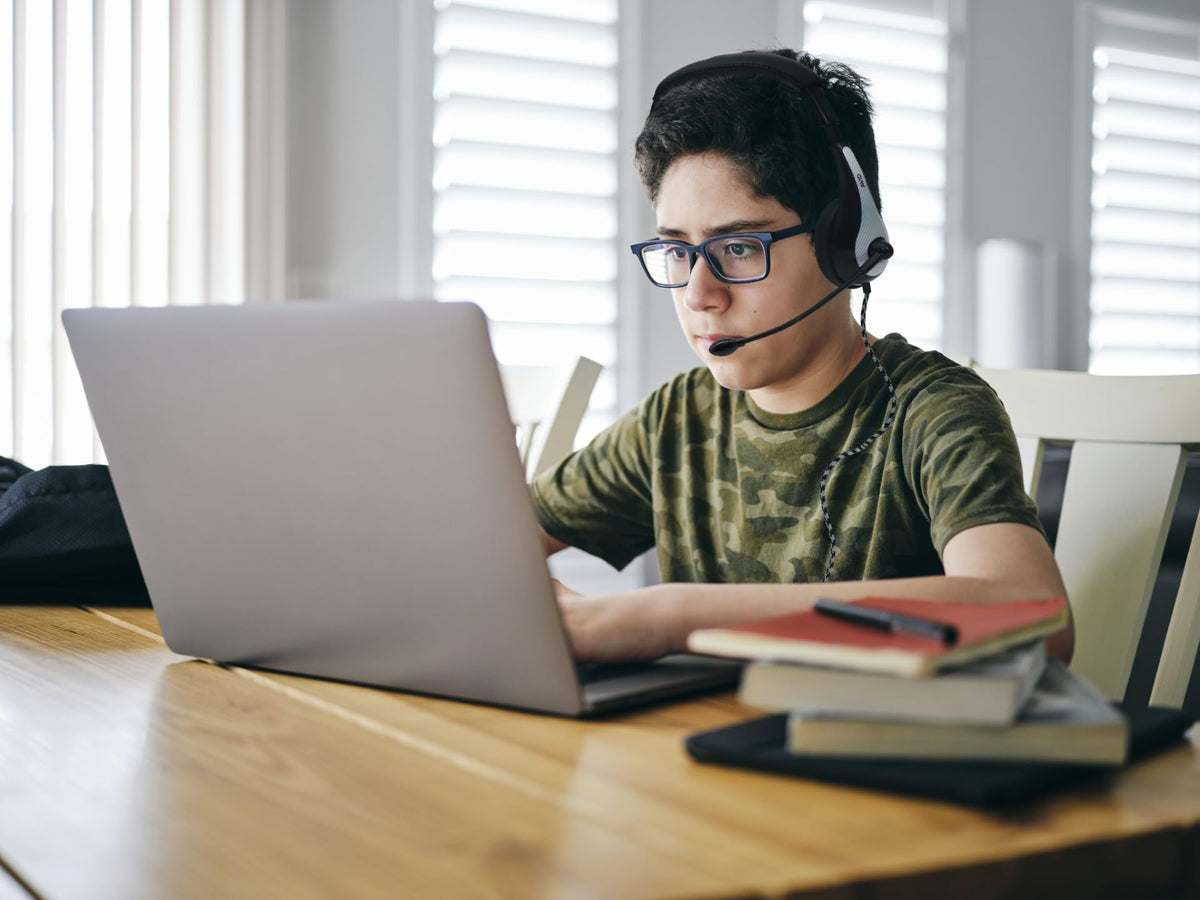 Avid AE-36 headset in classroom environment, suitable for labs, libraries, and testing.