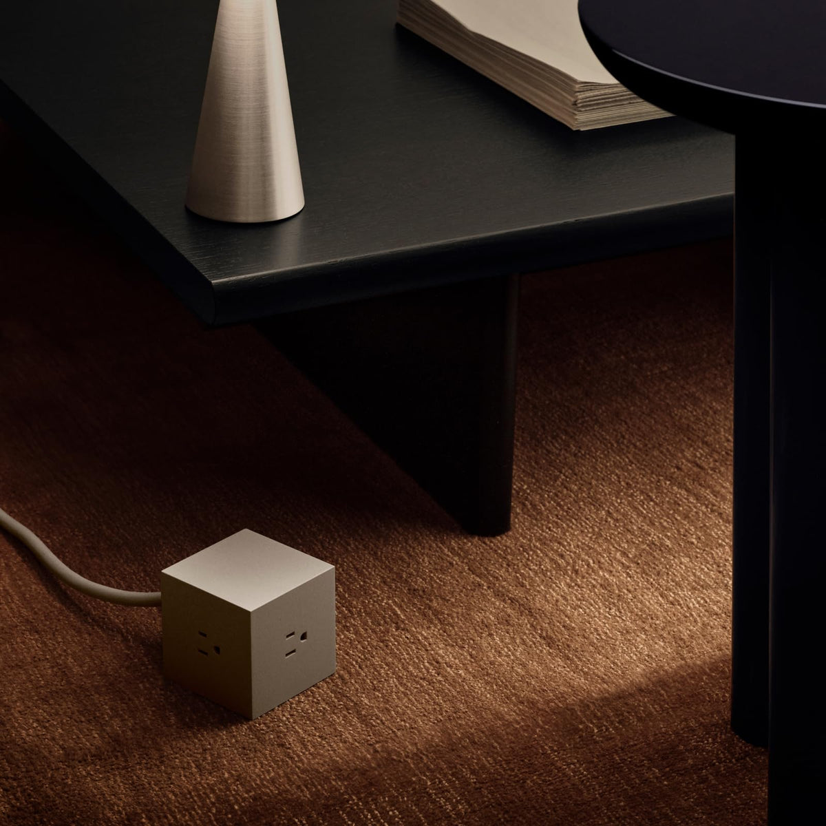 AVOLT angled view of three AC outlets accommodating multiple chargers neatly