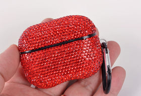 Close-up of red rhinestones on AXCUWS case showing luxury detail and grip