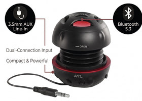 AYL Mini Speaker System charging via USB, showcasing long playback potential