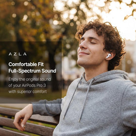 AZLA ear tip next to coin to show small size and precise fit