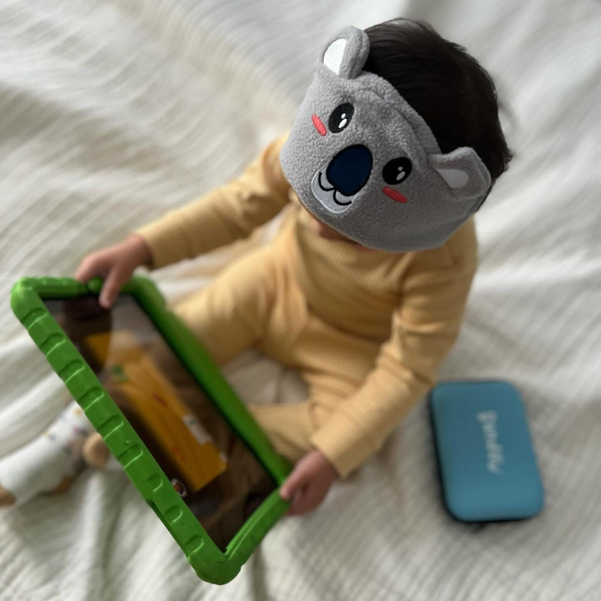 Bandou on a pillow in a bedtime scene promoting calm sleep listening