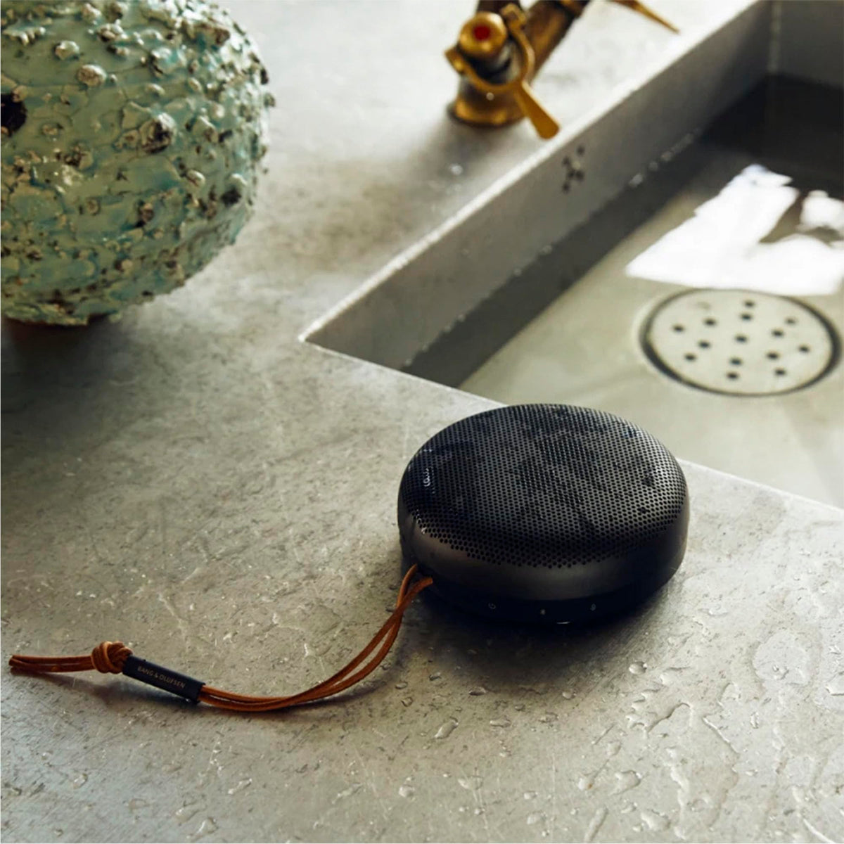 Beosound A1 2nd Gen waterproof and travel-ready for outdoor use.