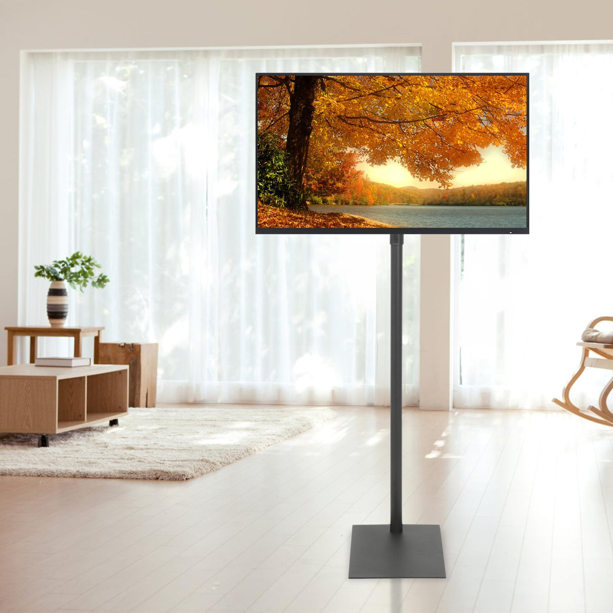 Baoz Floor TV Stand in a living room demonstrates space-saving freestanding design.