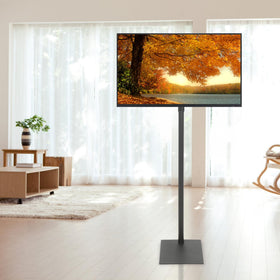 Baoz Floor TV Stand in a living room demonstrates space-saving freestanding design.