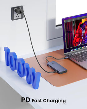 BAOZEE next to a phone and notebook showing compact size and portability
