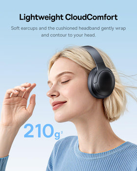 Baseus BH1 Lite worn by traveler on train showing noise-resistant call clarity