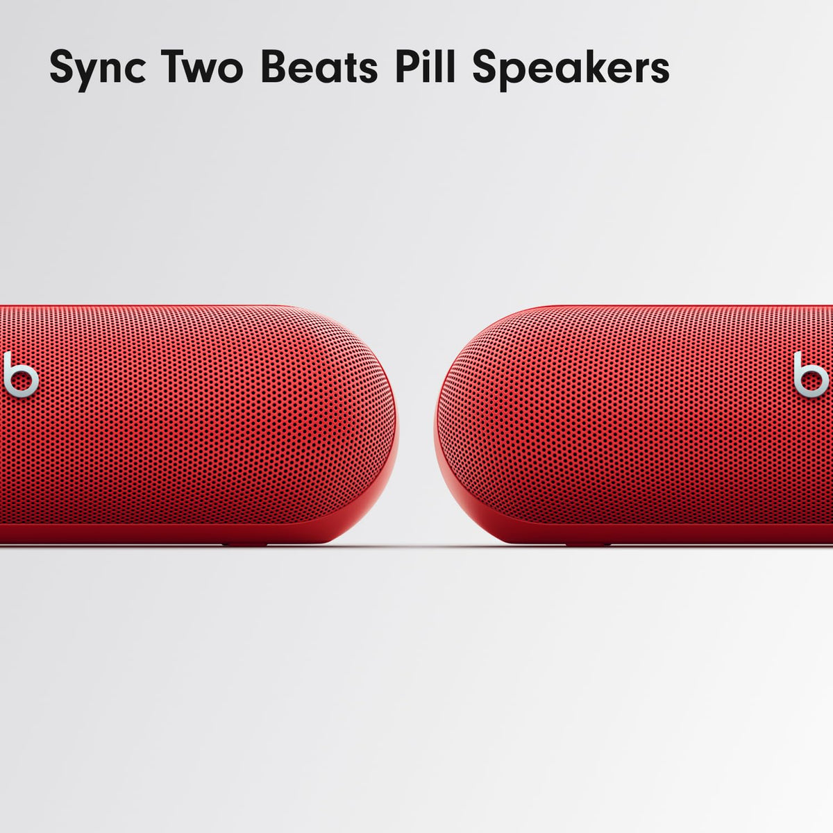 Beats Pill ready for travel with hands-free calls and voice assistant in red.