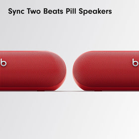 Beats Pill ready for travel with hands-free calls and voice assistant in red.