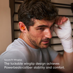 Beats Powerbeats Fit secure-wingtip close-up emphasizing stable fit during workouts