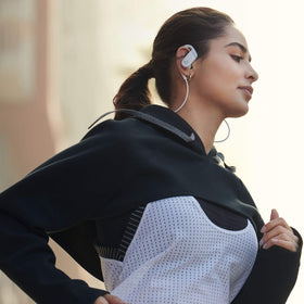 Beats Powerbeats white bundled with case and controls for hands-free use.