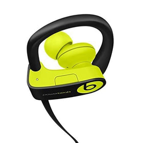 beats Powerbeats3 on gym towel with water droplets showing sweat resistance for workouts
