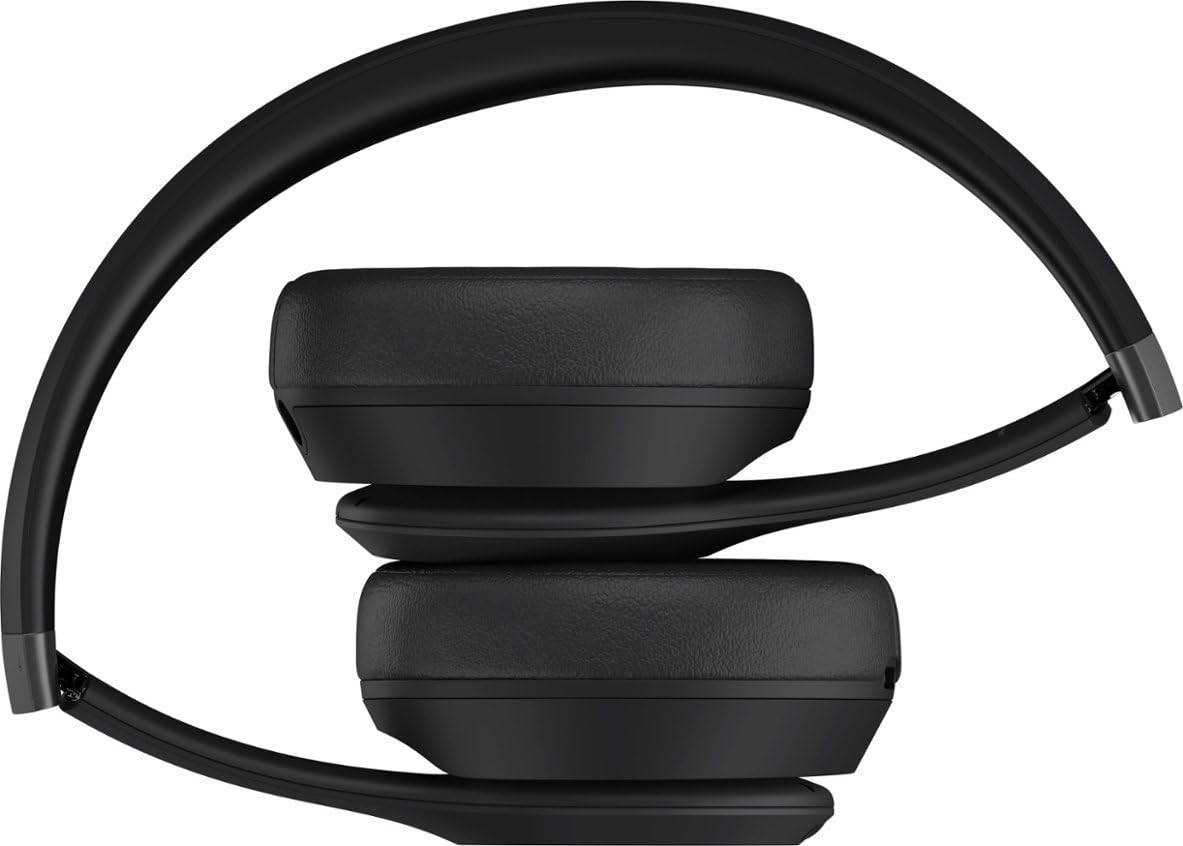 Beats Solo 4 on-ear headphones worn with a smartphone for wireless freedom.