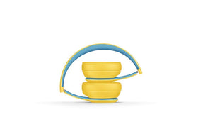 Beats Solo3 Wireless on-ear headphones in Club Yellow, folded-pocket shot for on-the-go portability.