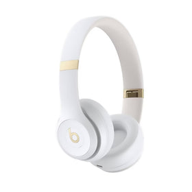 Beats Solo 4 ear cup close-up in warm white with cushioned comfort for everyday listening.