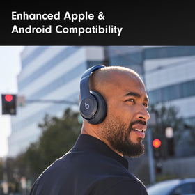 Beats Studio Pro Renewed Navy shown with a connected device for pairing