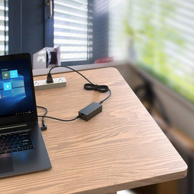 Belker 45W universal laptop charger in a workspace setup for daily use.