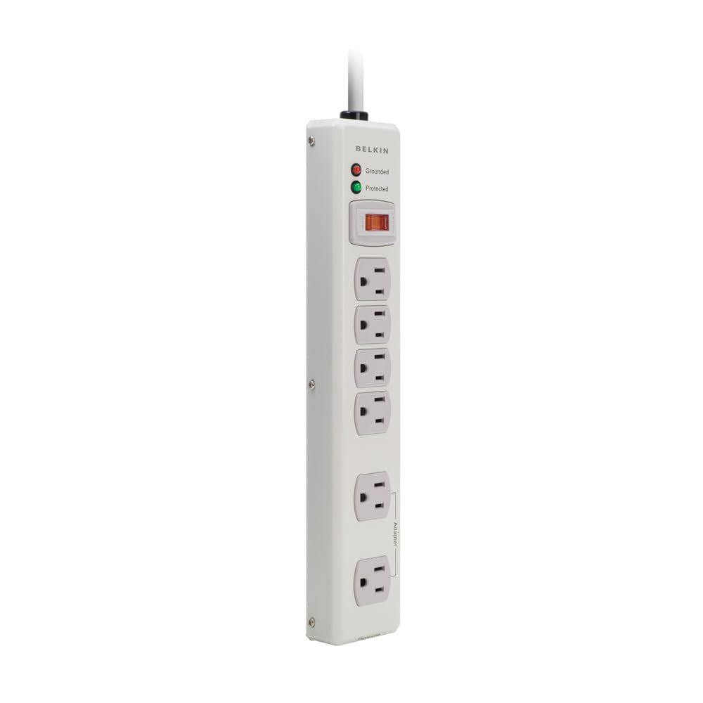 Belkin 6-outlet metal surge protector in beige with a 6 ft cord, safeguarding workshop gear.