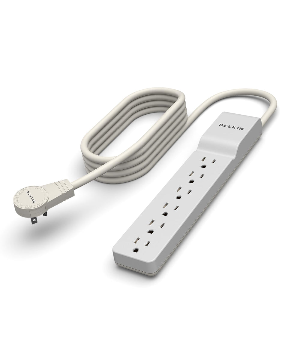 Belkin 6-outlet surge protector front view powers multiple devices at a tidy desk.