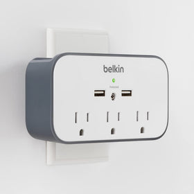 Compact, wall-mountable surge protector ready for desk or wall installation