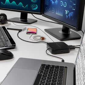 Belkin dock next to laptop for scale benefit compact footprint on desk