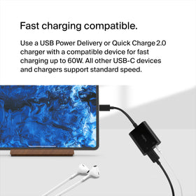 Belkin ROCKSTAR connected to an iPhone while headphones play, enables multitasking
