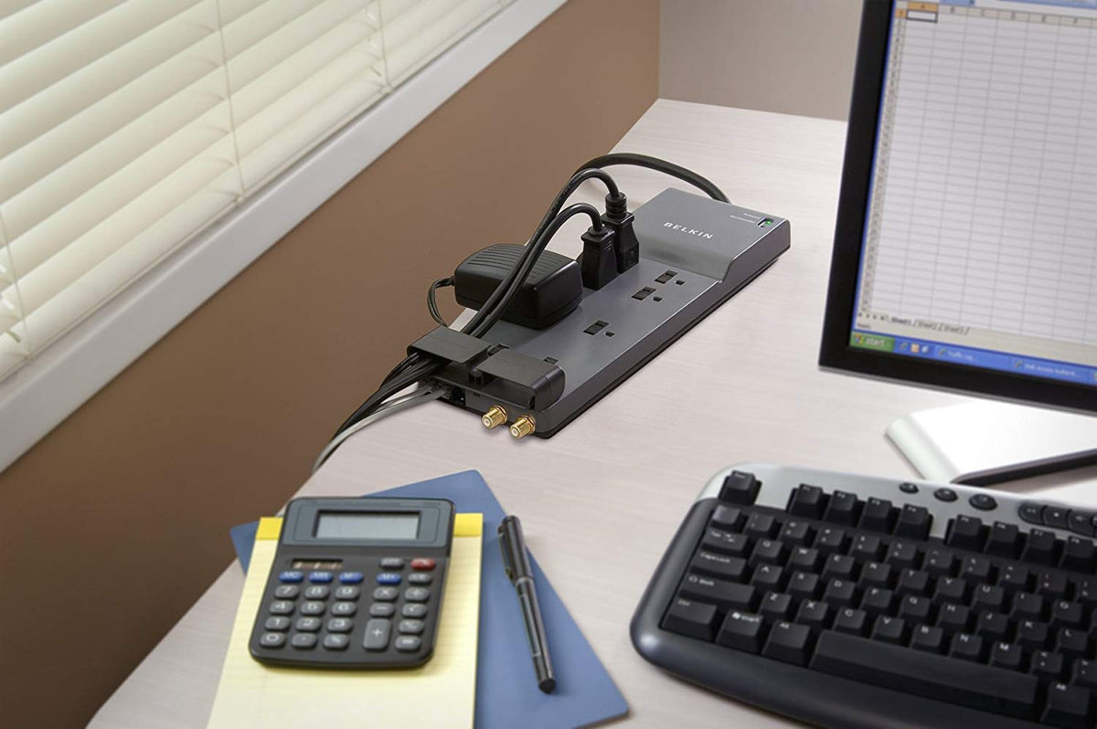 Belkin safety-slides outlets with cord-management clip help keep desks tidy.