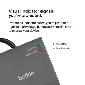 Belkin size comparison next to a laptop showing compact footprint