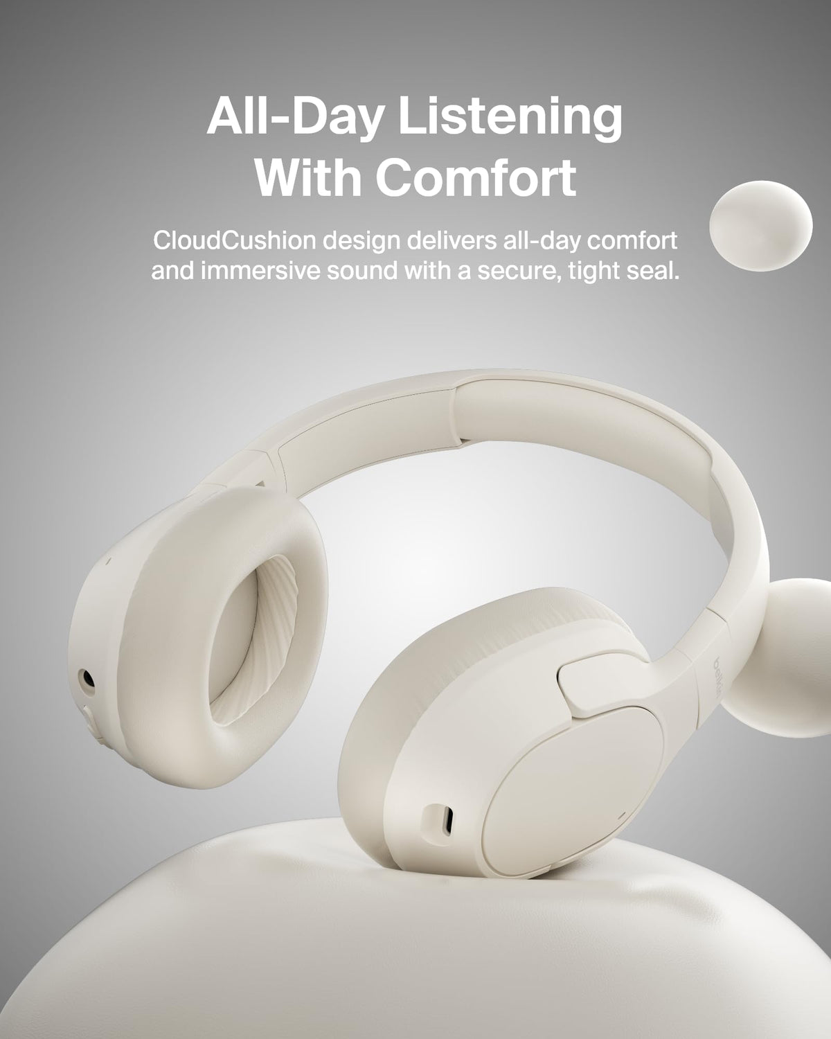 Belkin SoundForm Isolate worn at a desk demonstrating multipoint convenience