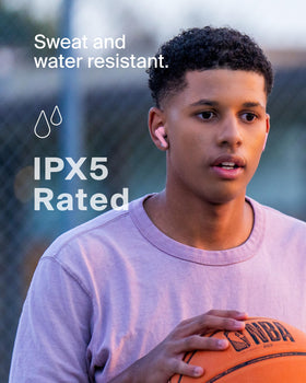 Belkin SoundForm Nano 2 with water splash illustrating IPX5 resistance for active play
