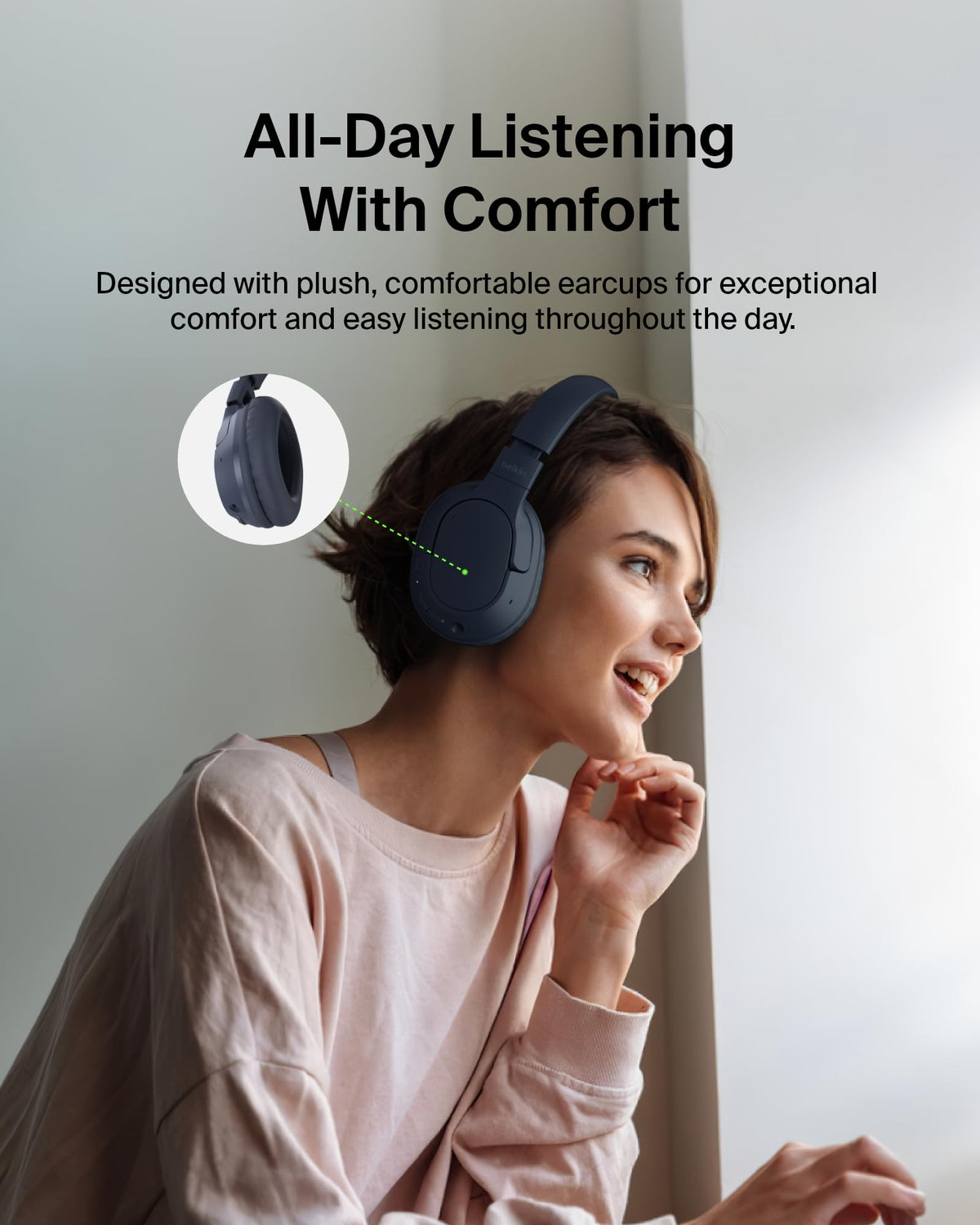 Belkin headphones worn at a desk providing focused listening for work